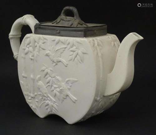A Victorian Copeland Spode bisque teapot with Aesthetic peri...