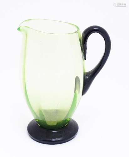 An early 20thC Uranium glass water jug / pitcher, the pale g...