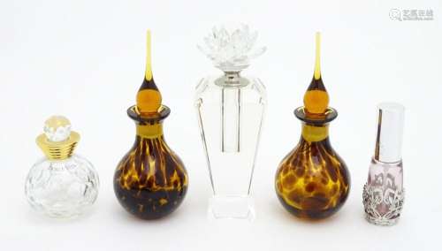 Assorted glass scent / perfume bottles. The tallest approx. ...