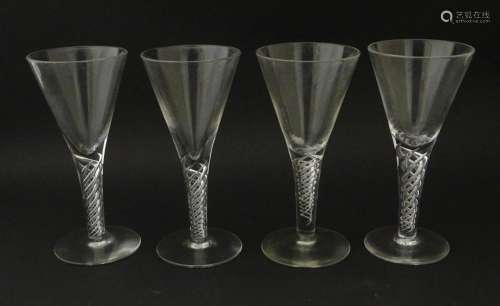 Four late 20thC drinking gasses with air twist detail to ste...