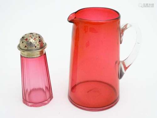 A cranberry glass sugar shaker with a silver lid hallmarked ...