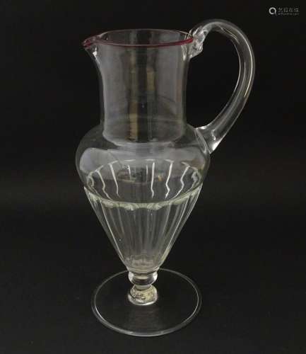 Salviati & Co. Glassware: A Venetian glass jug of pedest...