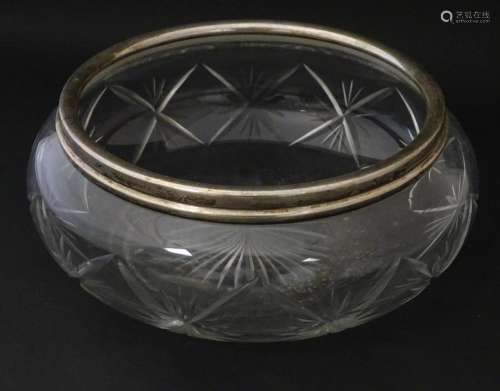 A cut glass bowl with silver rim hallmarked London 1927. App...
