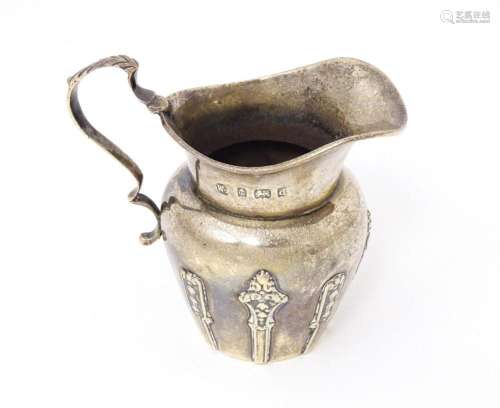 A silver cream jug hallmarked Birmingham 1903 maker William ...