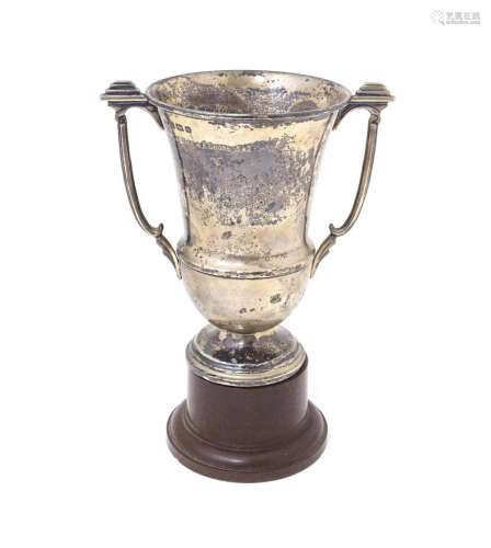 An Art Deco silver trophy cup with twin handles. Hallmarked ...