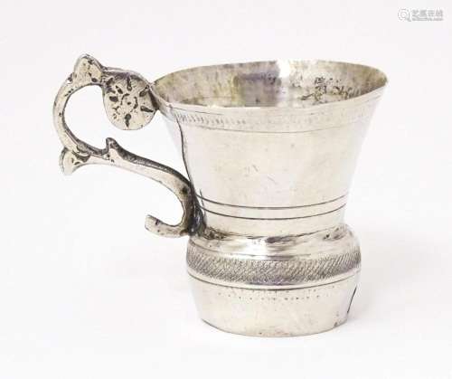 A Continental silver tot cup with scroll handle, possibly Au...