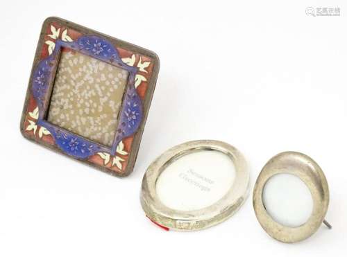 Three various miniature photograph frames to include two sil...
