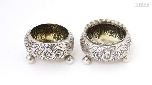 Two Victorian silver salts with embossed decoration, one hal...