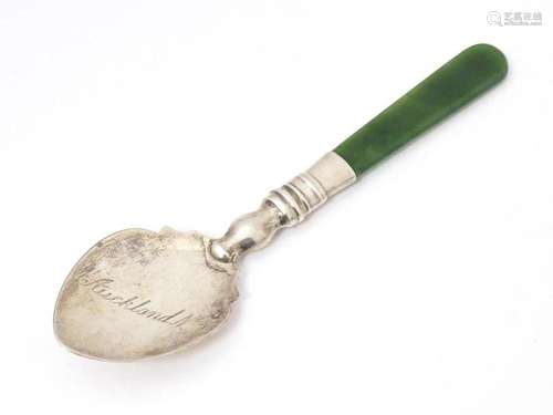 A silver souvenir spoon with a New Zealand jade nephrite han...