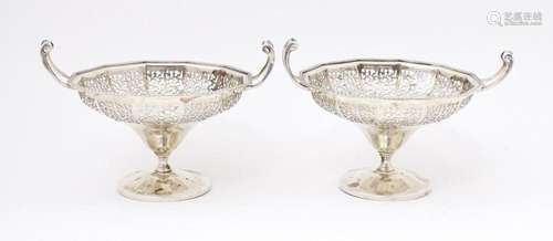 A pair of silver bon bon dished of pedestal form with pierce...