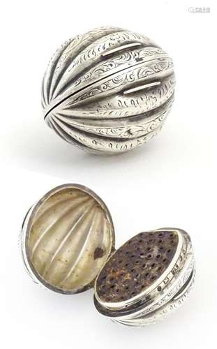 A Victorian silver nutmeg grater of melon form with engraved...