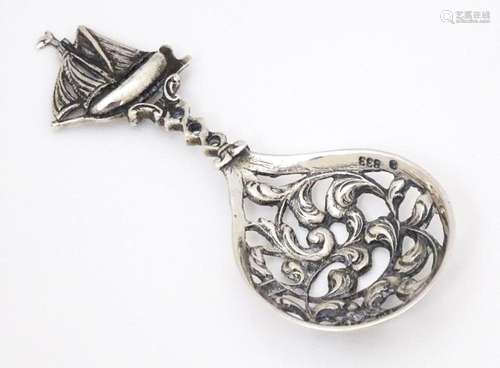 A Continental .833 silver spoon with pierced decoration to b...