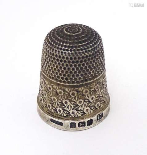 A silver thimble hallmarked Birmingham 1927 maker Henry Grif...