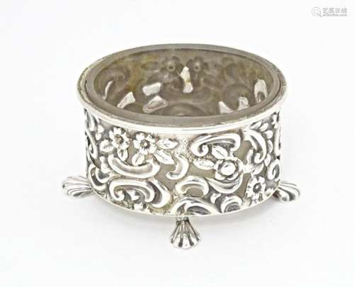 A Victorian silver salt of oval form with embossed decoratio...