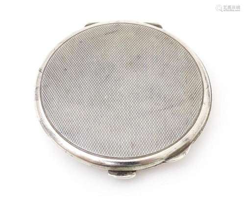 A Silver compact with engine turned decoration. Hallmarked B...