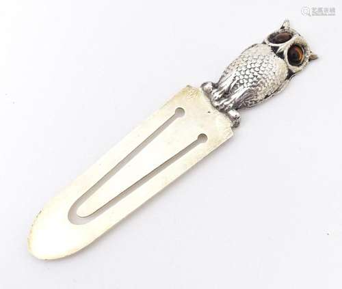 A silver plate bookmark with owl decoration. 3 1/2" lon...