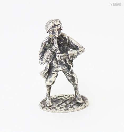 A silver model of musician plying an instrument. Hallmarked ...