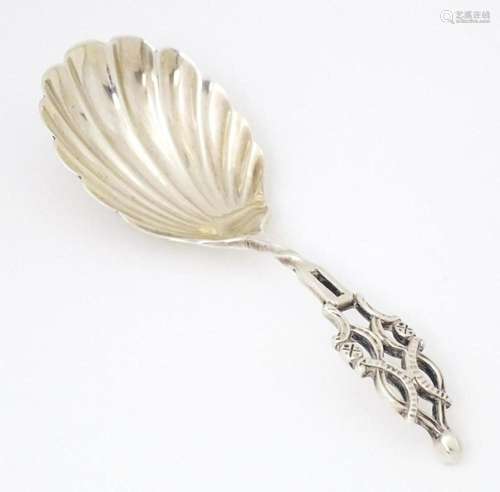 A Victorian silver caddy spoon with shell formed bowl and op...