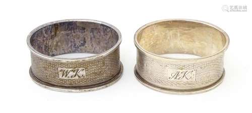 A pair of napkin rings of oval form with engine turned decor...