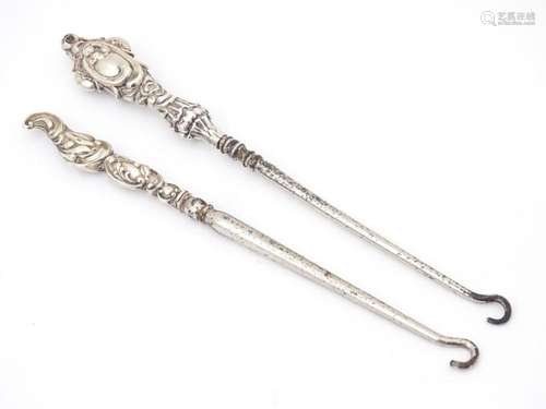 Two silver handled button hooks. One hallmarked Birmingham 1...