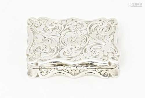 A Victorian silver vinaigrette with engraved acanthus scroll...