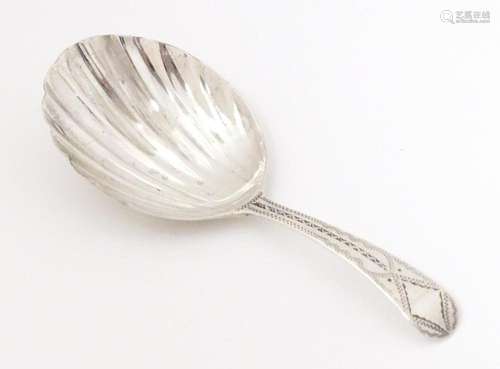 A Geo III silver caddy spoon with shell formed bowl, hallmar...