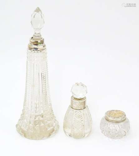 Three cut glass dressing table bottles / pots. The tallest h...