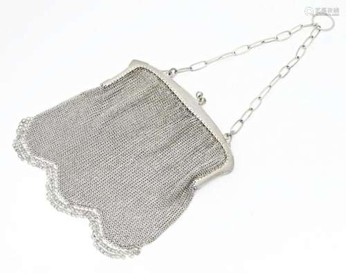 An early 20thC silver bag / purse with mesh body and hanging...