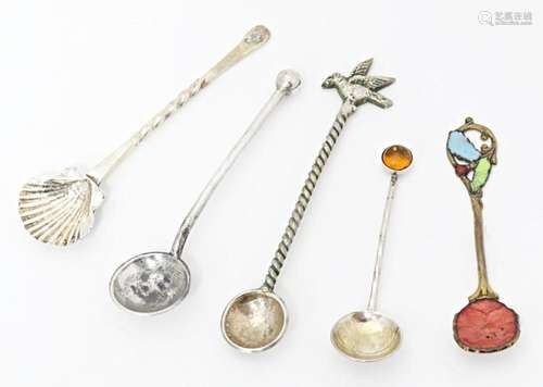 Five assorted salt spoons to include a silver example. Large...