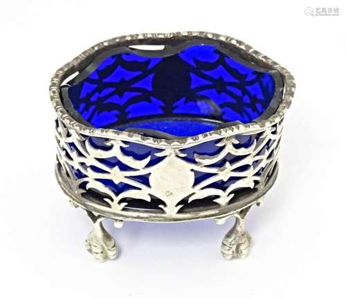 A Victorian silver salt with pierced decoration and blue gla...