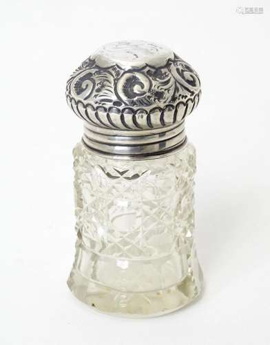 A cut glass salts jar with silver lid, hallmarked London 190...