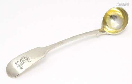 A Victorian silver Fiddle pattern salt spoon with gilded bow...