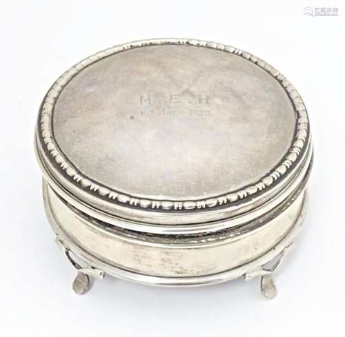 A silver ring box of circular firm with out swept feet, hall...