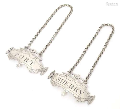 A pair of Victorian silver wine / decanter labels / bottle t...