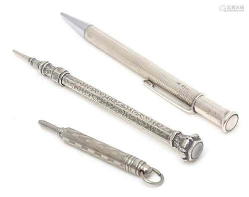 Three propelling pencils comprising a silver propelling penc...