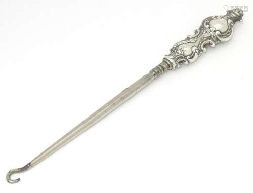 A silver handled button hook hallmarked Birmingham 1908, mak...