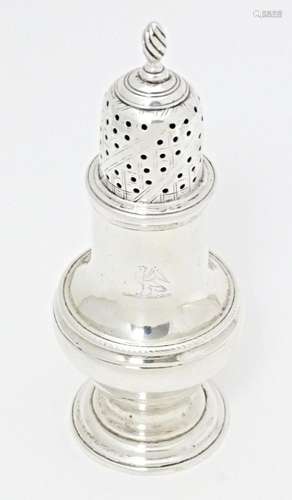 A Geo III silver pepperette / sugar sifter, hallmarked Londo...