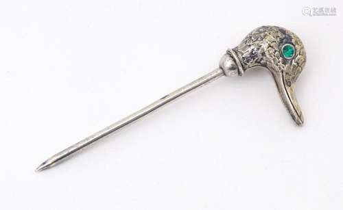 A silver plate skewer / place card holder , the top surmount...