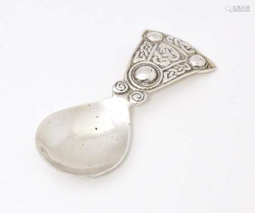 A caddy spoon with Scottish Celtic decoration hallmarked Che...
