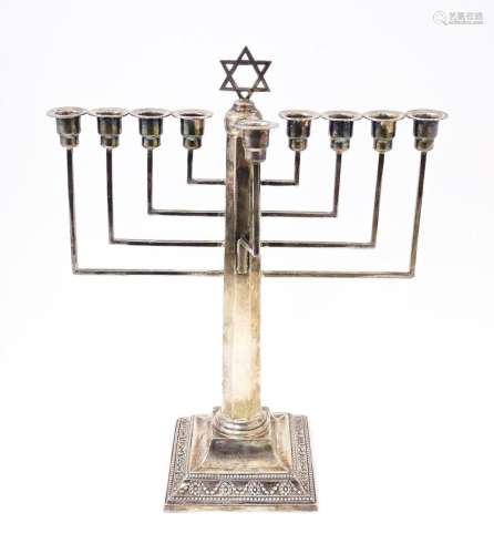 Judaica : A silver Hanukkah Menorah with 9 branches and surm...