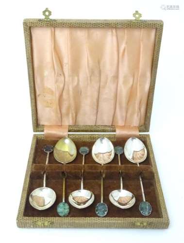 A set of six Oriental style teaspoons with carved jade style...
