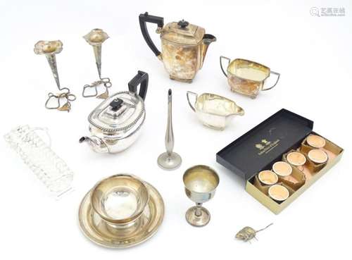 A quantity of assorted silver plated wares to include napkin...