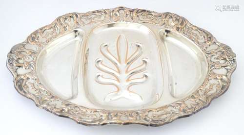 A 19thC silver plate meat plate of oval form with tree and w...