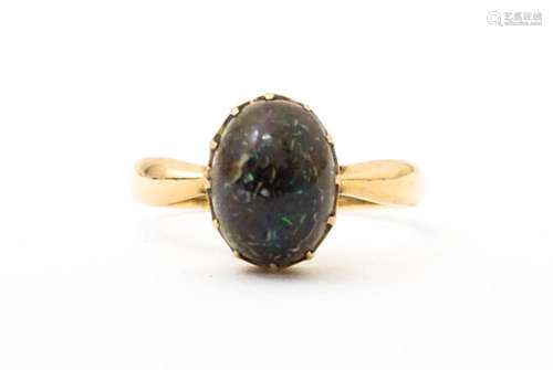 A 9ct gold ring set with black opal, hallmarked Birmingham 1...