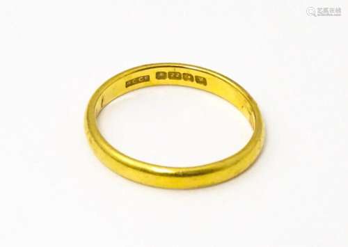 A 22ct gold ring. Ring size approx. N