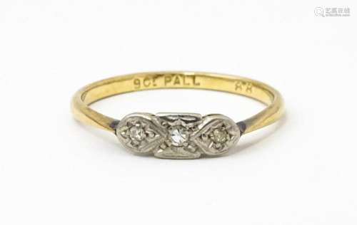 A 9ct gold ring with palladium set diamonds to top in an Art...