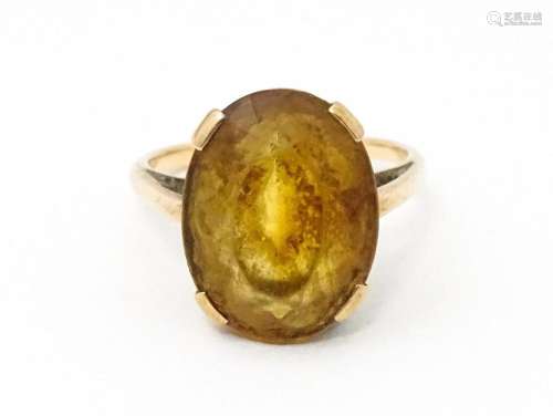 A 9ct gold ring set with oval citrine. Ring size approx. P