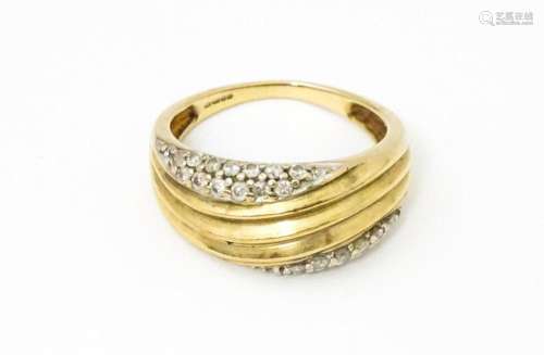 A 9ct gold ring set with diamonds, Ring size approx. M 1/2