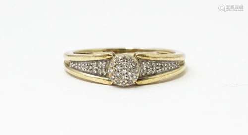 A 9ct gold ring set with diamonds. Ring size approx. M 1/2