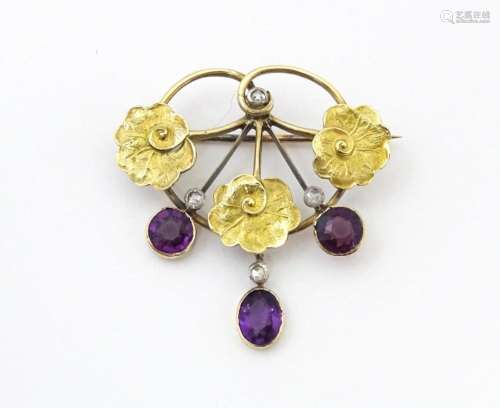 A Continental Art Nouveau gold brooch set with amethyst and ...